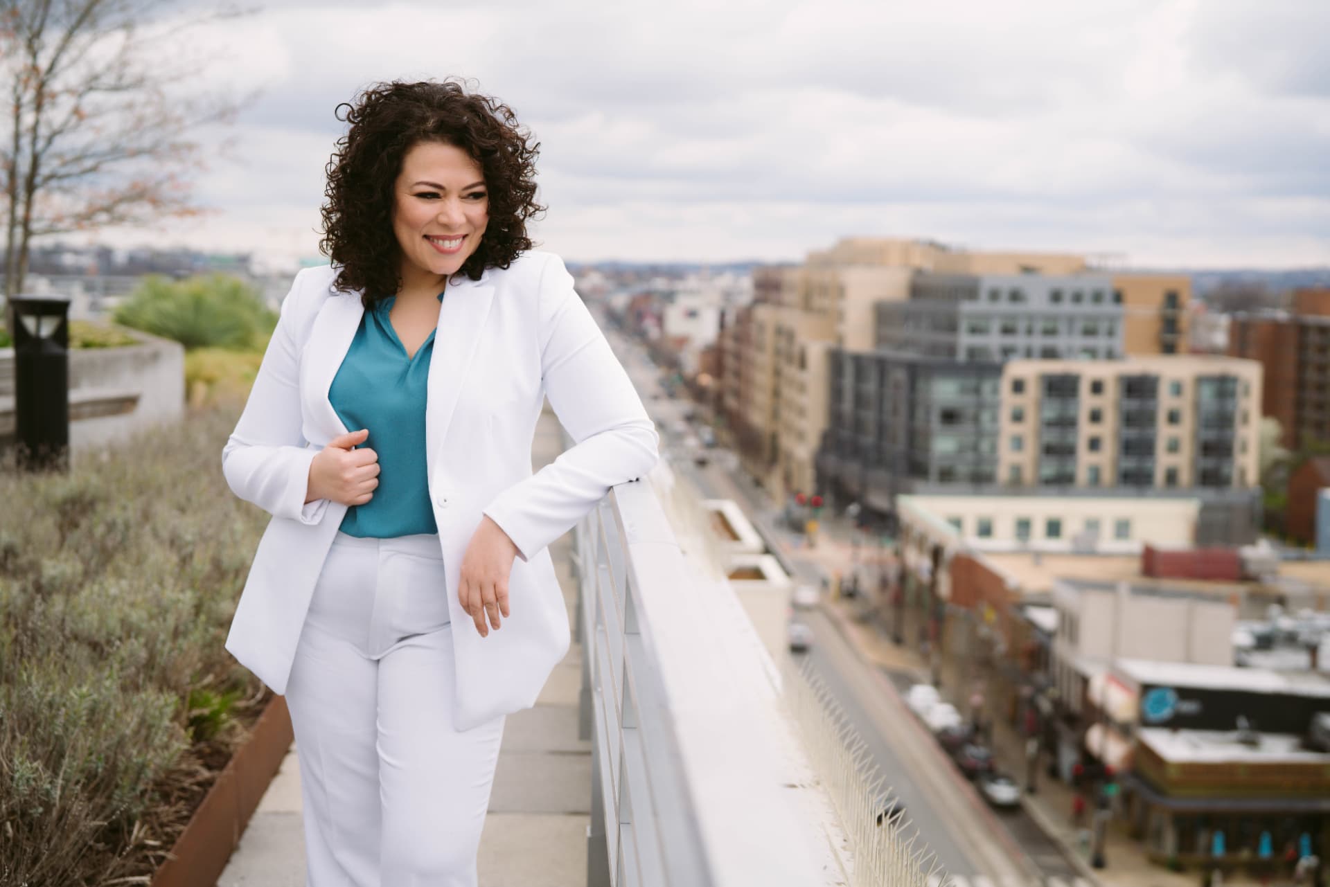 Dina Scippa, founder of Enough Labs, on a rooftop overlooking the city